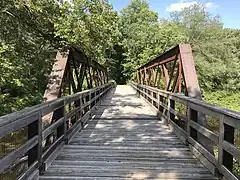 Pony truss bridge over Ware river entering Wheelwright