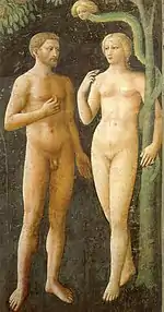 A fresco showing Adam and Eve tempted by the Devil. Eve holds a piece of fruit while Adam gestures towards  it. The figures look slim, youthful and beautiful. Adam is bearded and tanned; Eve is blonde and pretty.