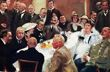 On the right at Akseli Gallen-Kallela's 50th birthday party, painting by Antti Favén&nbsp;[fi], 1915