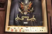 Flag of the US 31st Infantry Regiment and UN insignia, captured during the Korean War.