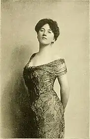 Youngish white woman in late Victorian day wear