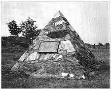 Monument erected 1904 by the Jackson Iron Company at the site of the discovery of ore after destruction of the stump. The monument is now located on US 41.