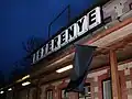 Building of railway station at Kisterenye on the line 84 with a black flag for the memorial of the passenger transportation on the line.