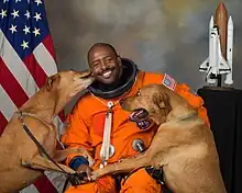 Image 50NASA astronaut Leland D. Melvin with his dogs Jake and Scout (from Dog behavior)