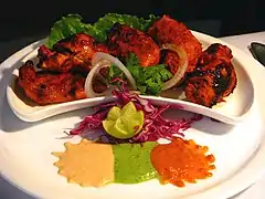 Image 27Chicken tikka, a well-known dish across the globe, reflects the South Asian cooking style. (from Culture of Asia)
