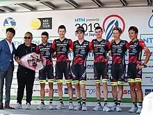 Photograph of Raymond Kreder, Team Ukyo, Kōhei Uchima, Tarō Shirato, Robbie Hucker, Yūma Koishi, Benjamín Prades, Sam Crome, and Tadahiko Kuwabara