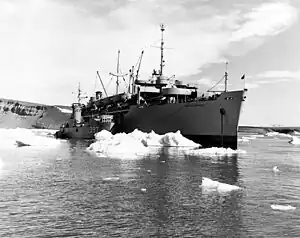 USS LSM-397 alongside the USNS General A.W. Greely (T-AP-141) amid the ice at Thule, Greenland, during Operation "Blue Jay", 19 July 1951
