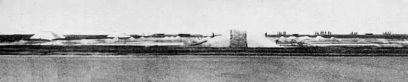 Farmers of forty centuries - Salt stacks and salt windmills.jpg