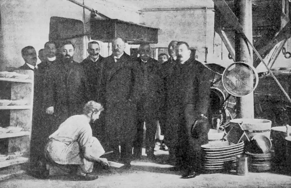 image of the workman cleaning the shoes