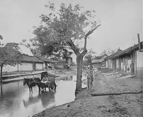 Street Scene in Pekin, after rain.jpg